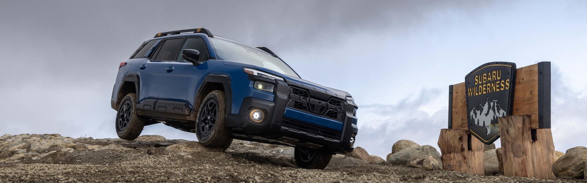 2026 Subaru Outback Wilderness Rock Climbing Banner