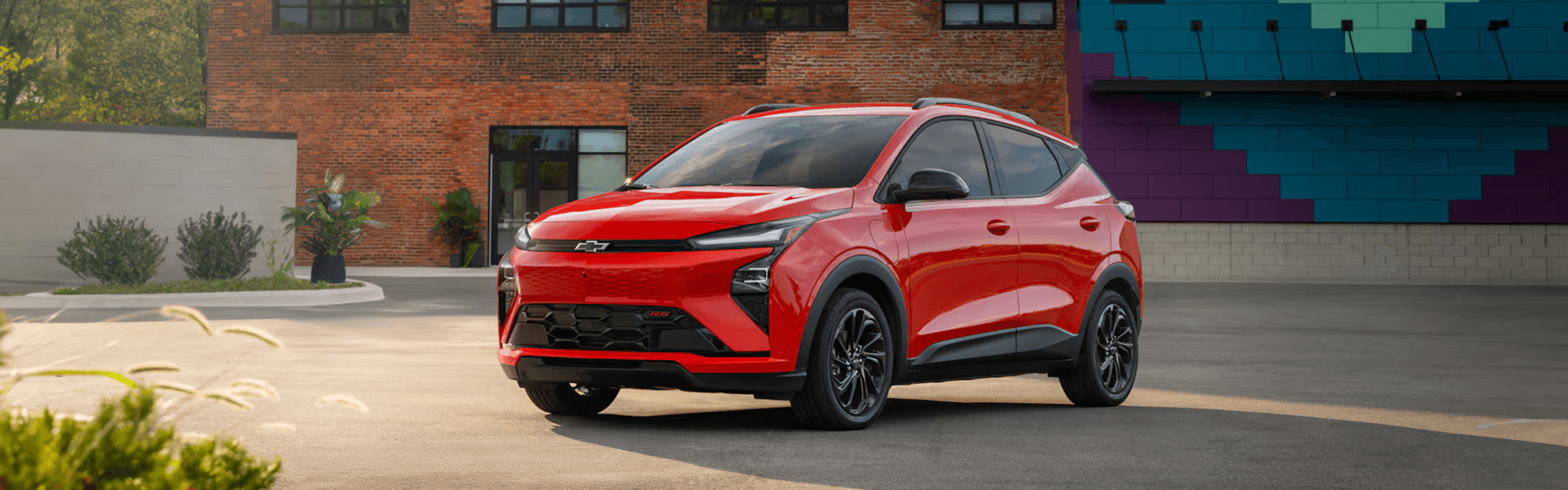 2027 Chevrolet Bolt Parked In A Parking Lot Banner