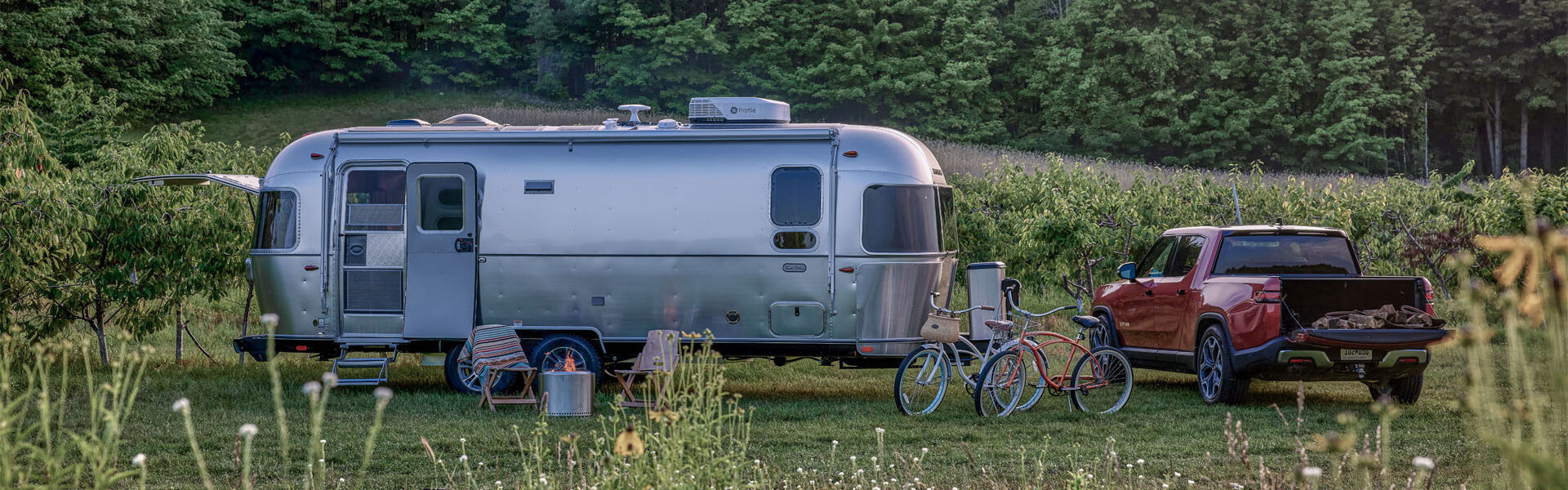 Airstream among lush wildness banner