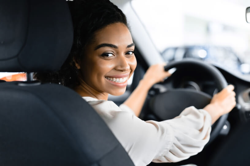 Car Lifestyle - Smiling Woman Driving A Car
