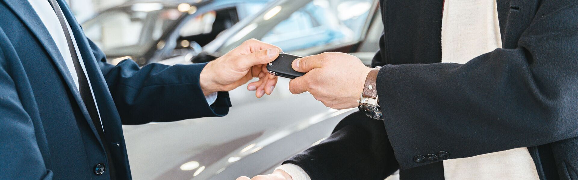 Car Salesman Handing Over Keys Banner