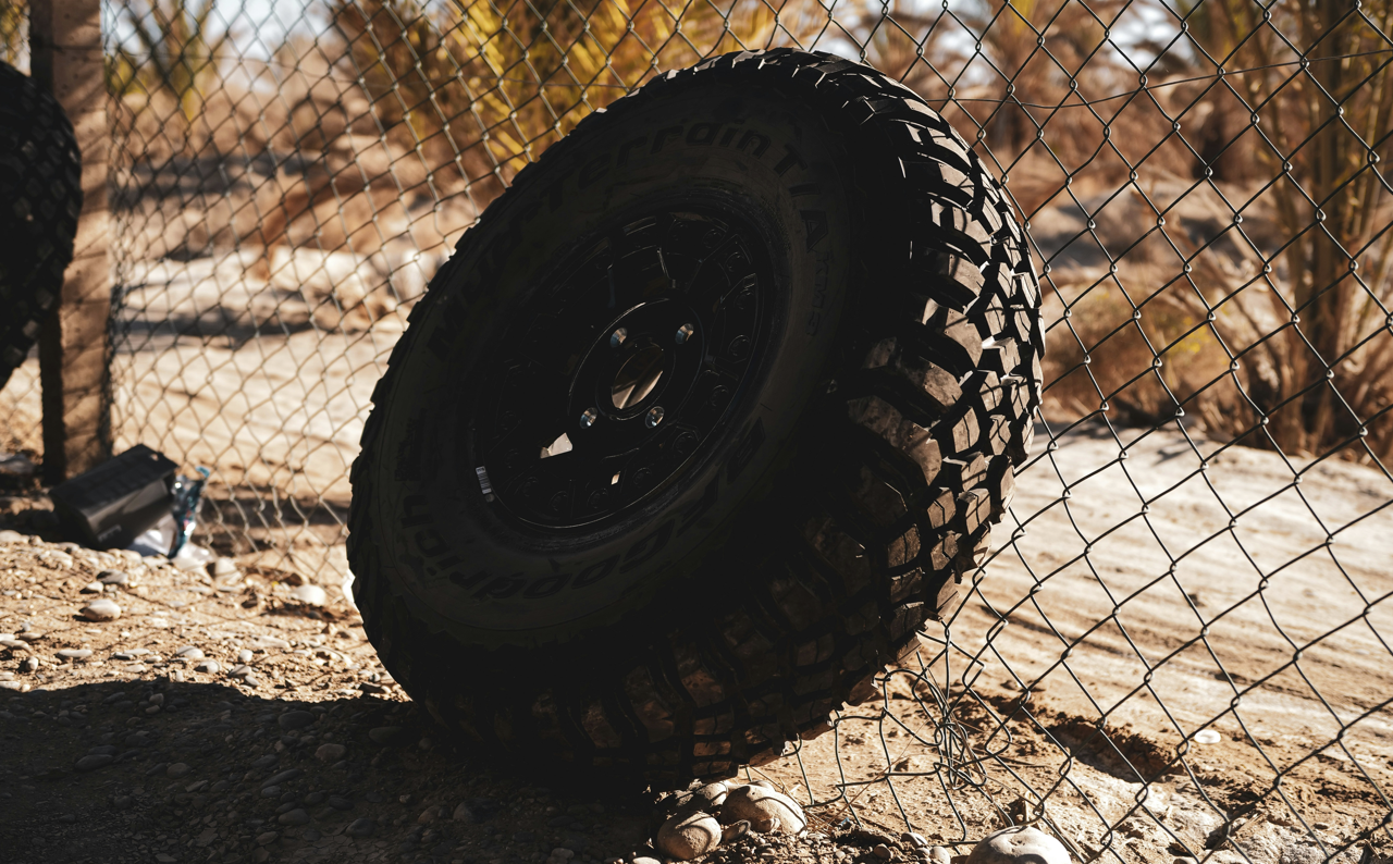car tire against the fence
