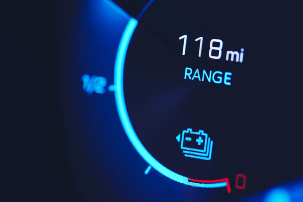 Close In Shot Of Electric Car Battery Range Gauge - Feature Image