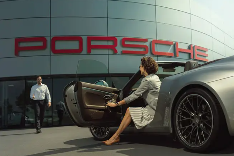 Customer getting to a Porsche dealership
