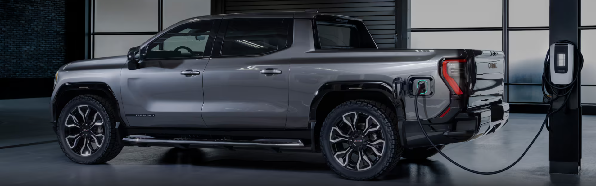 GMC Sierra Denali Edition 1 charging with side view-Banner