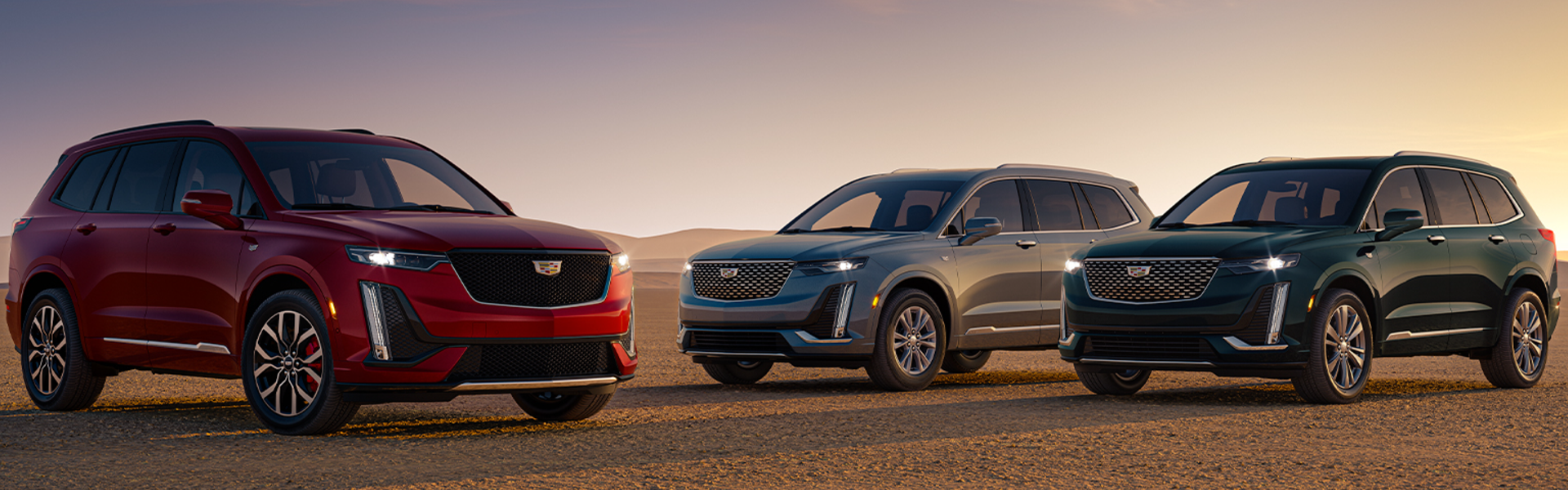 Lineup of Cadillac SUVs with front view-Banner