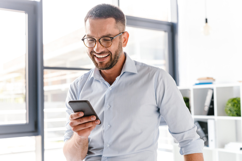 Man Using Smartphone Payment Calculator Feature Image