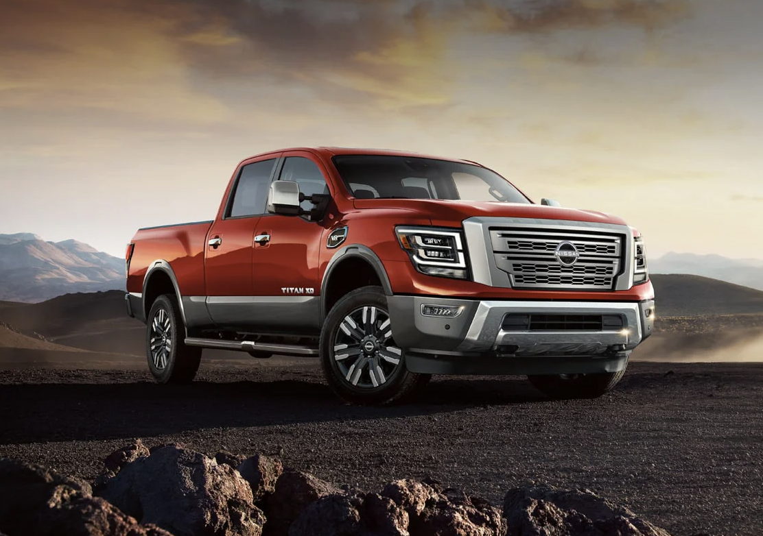 Pre-Owned 2023 Nissan TITAN XD in red parking in construction zone