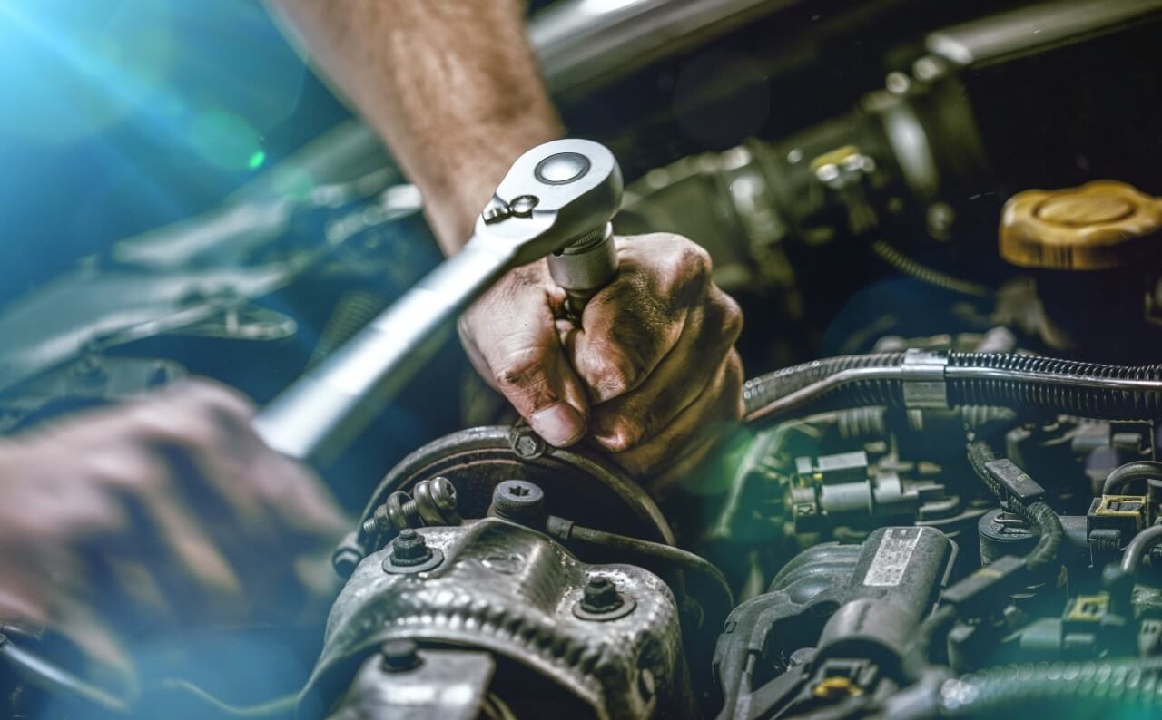Service - Auto Mechanic Working on Car Engine
