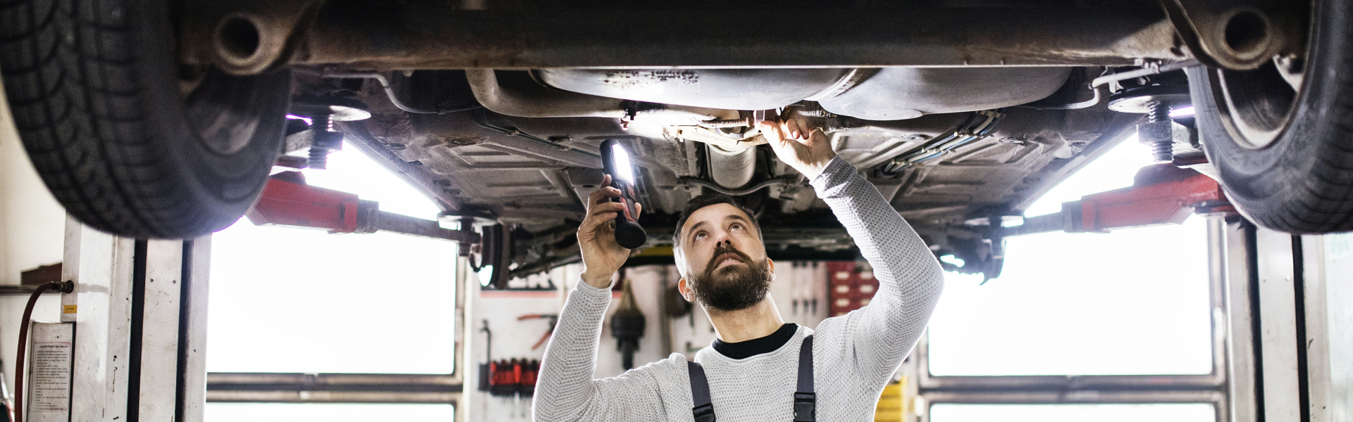 technician checking under the vehicle
