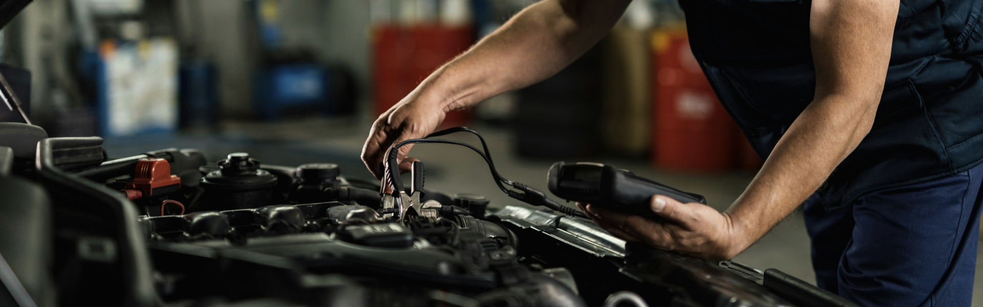 technician checking vehicle battery
