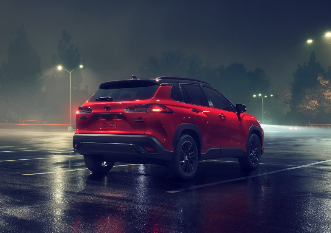 Used Toyota Corolla Cross in red with rear view