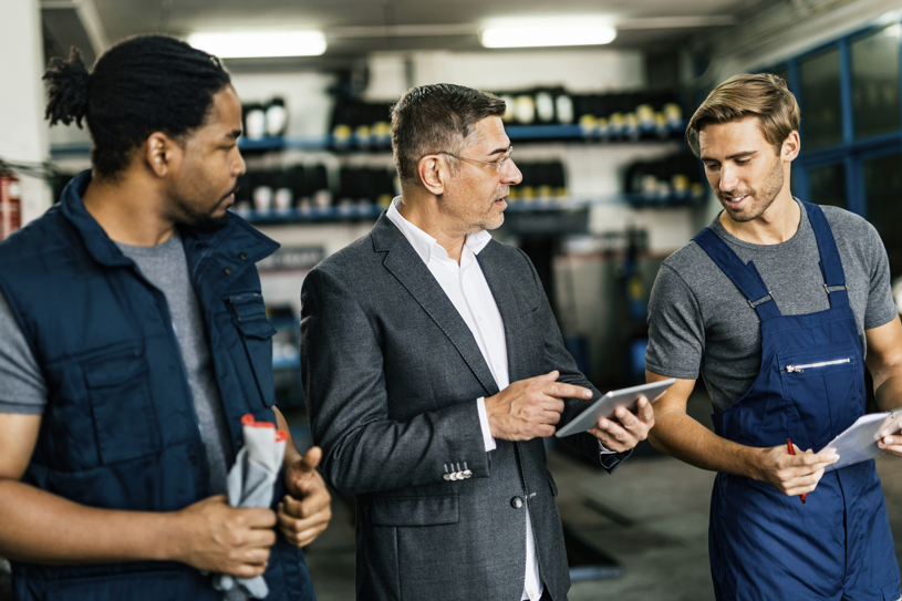 vehicle upgrade engineers discussing with each other
