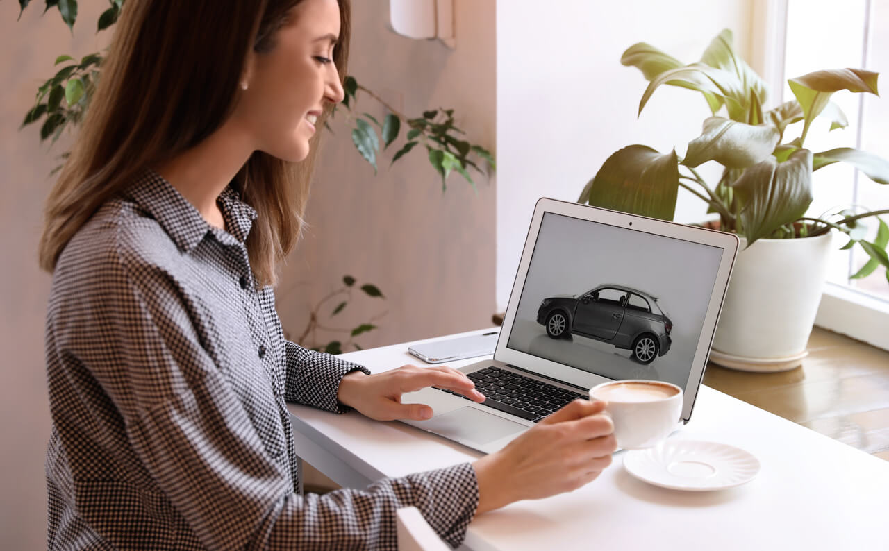 Woman shopping for cars online feature image