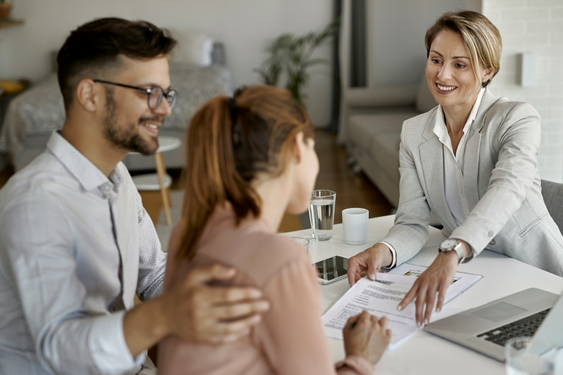 women explaining financing progress to couple